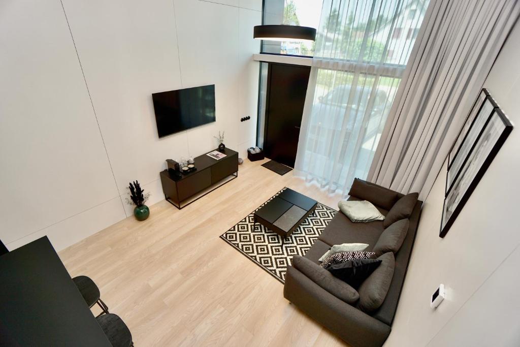 TV a/nebo společenská místnost v ubytování Chalet Park by Maier Mäder