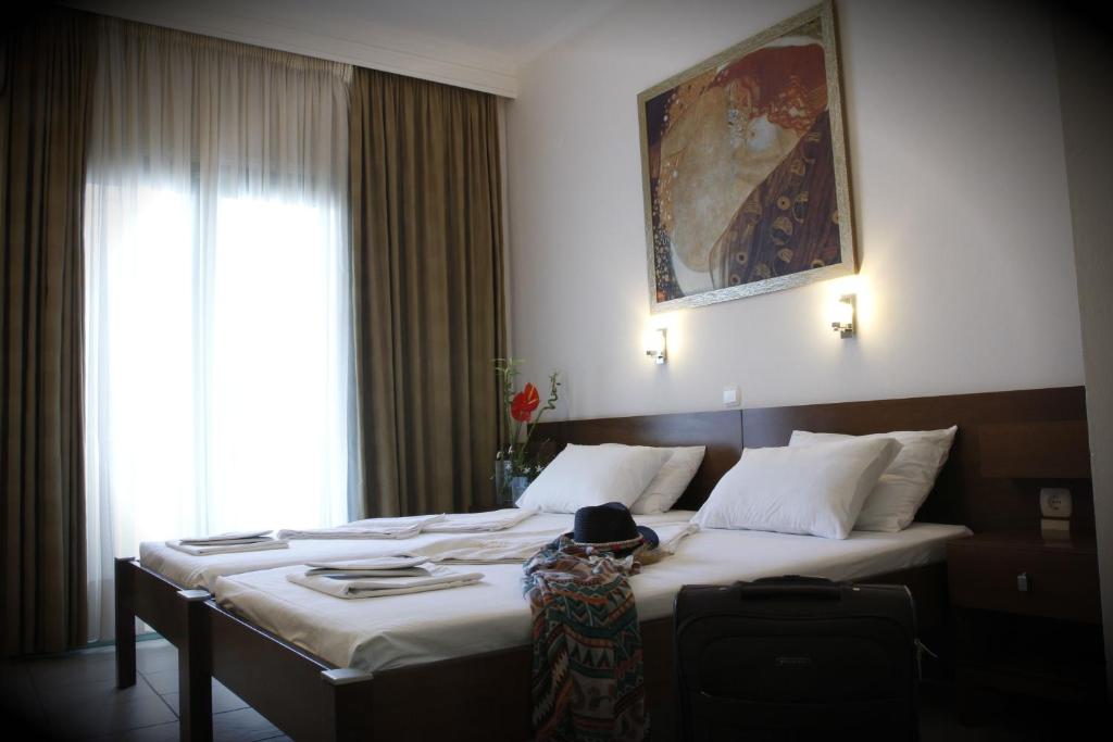 Postel nebo postele na pokoji v ubytování Hotel Kostis