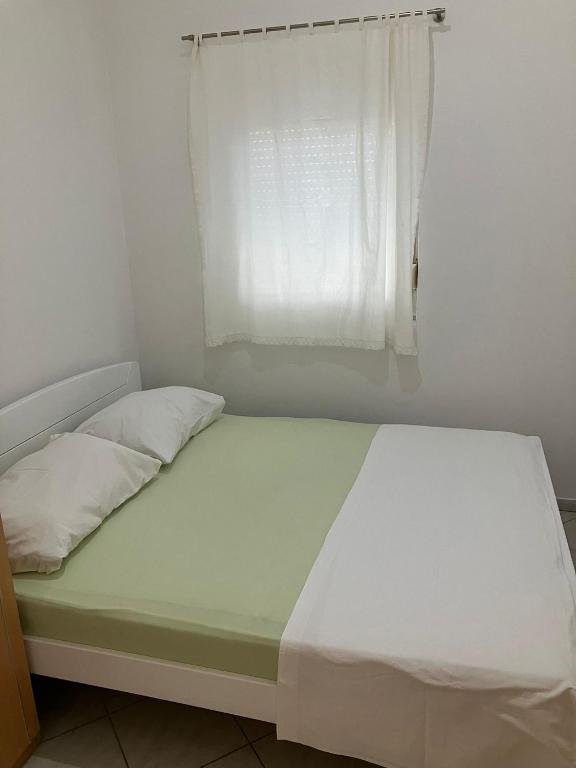 Postel nebo postele na pokoji v ubytování Apartments Nives
