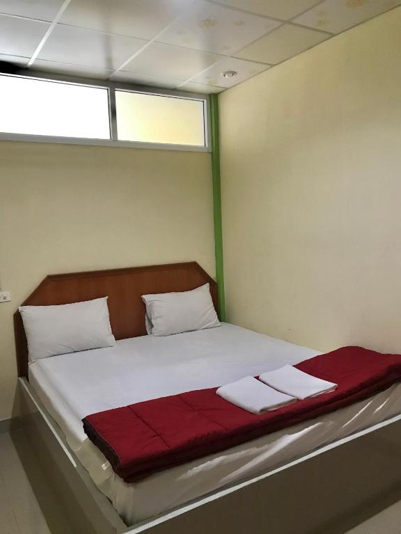 Postel nebo postele na pokoji v ubytování Tanarod Gueshouse