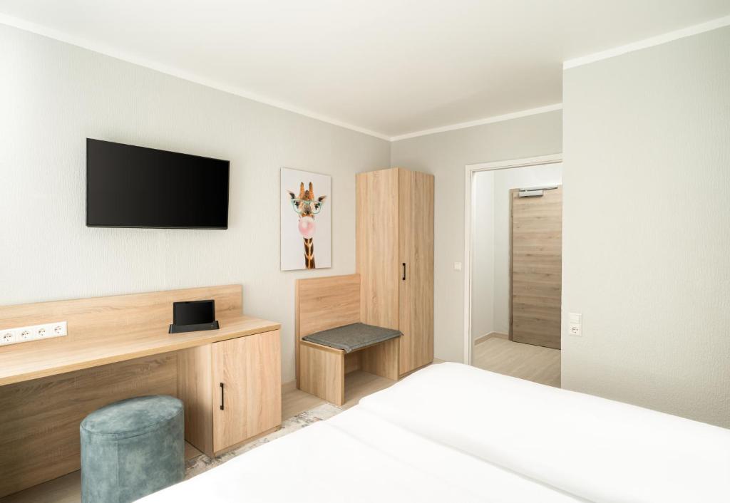 TV a/nebo společenská místnost v ubytování Arthotel ANA Eden