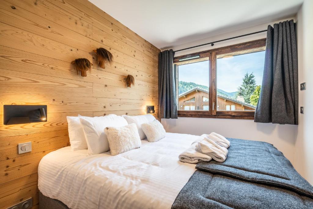 Un ou plusieurs lits dans un hébergement de l'établissement Apartment Lizay Morzine - by EMERALD STAY