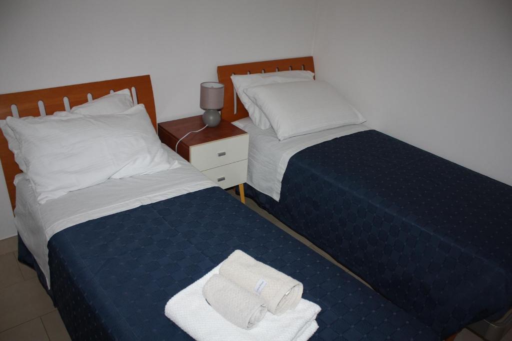 Una cama o camas en una habitación de TETI Rooms