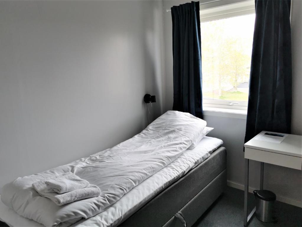 Postel nebo postele na pokoji v ubytování Lofoten Overnatting - Leknes