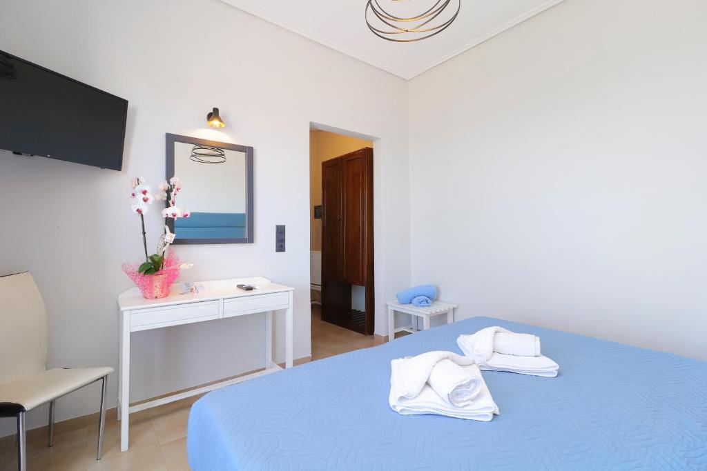 Postel nebo postele na pokoji v ubytování Alexis Hotel