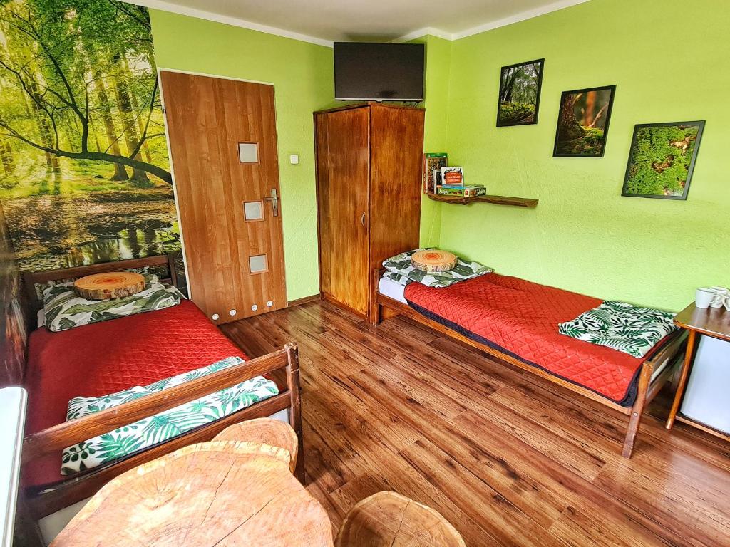 Łóżko lub łóżka w pokoju w obiekcie Agroturystyka Nowy Kraków