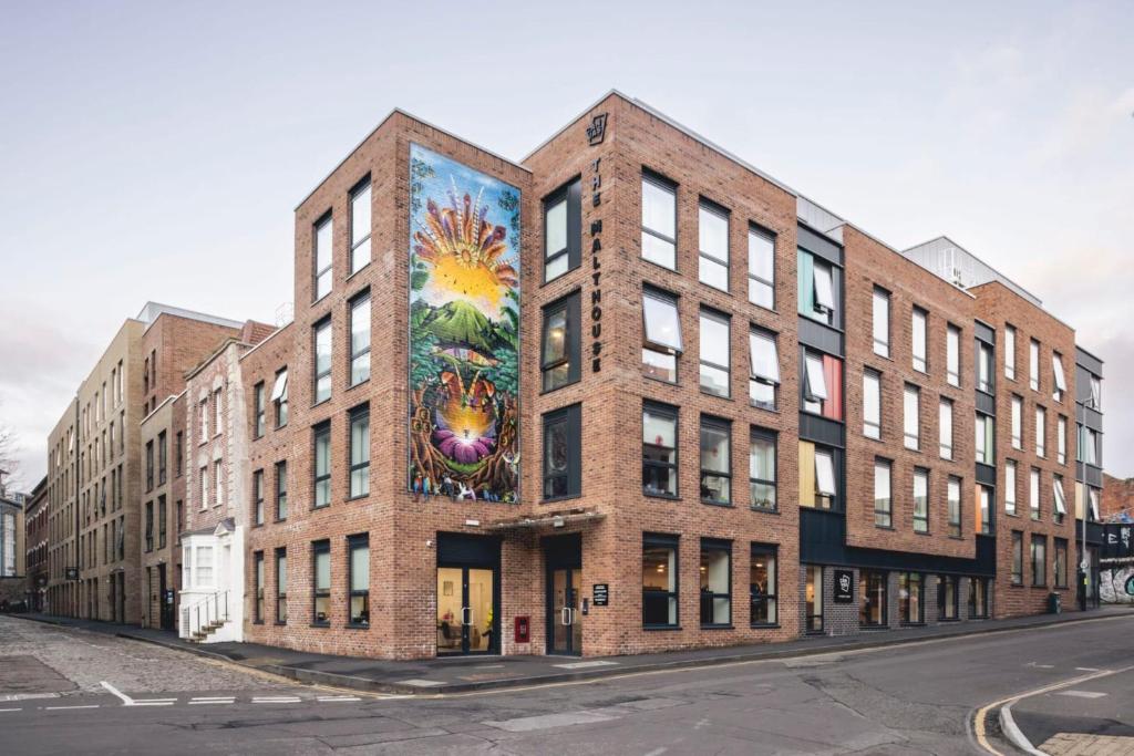 a building with a painting on the side of it at Studios and Private Bedrooms with Shared Kitchen at Canvas Bristol near the City Centre in Bristol