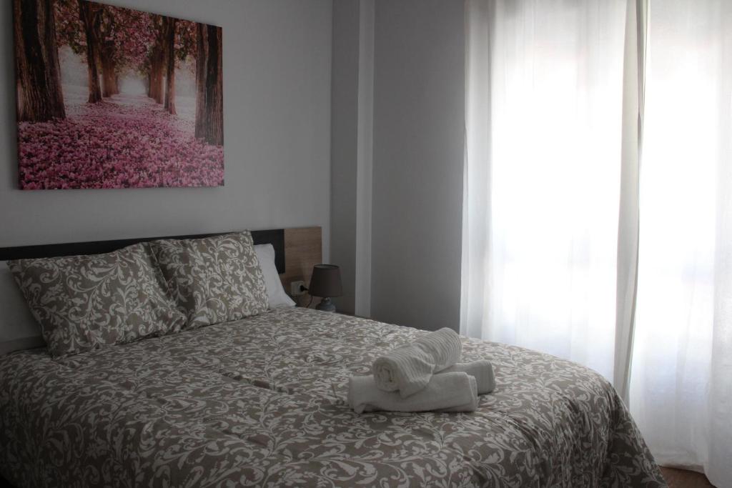 Postel nebo postele na pokoji v ubytování INCREIBLE APARTAMENTO CENTRO GRANADA ALHAMBRA