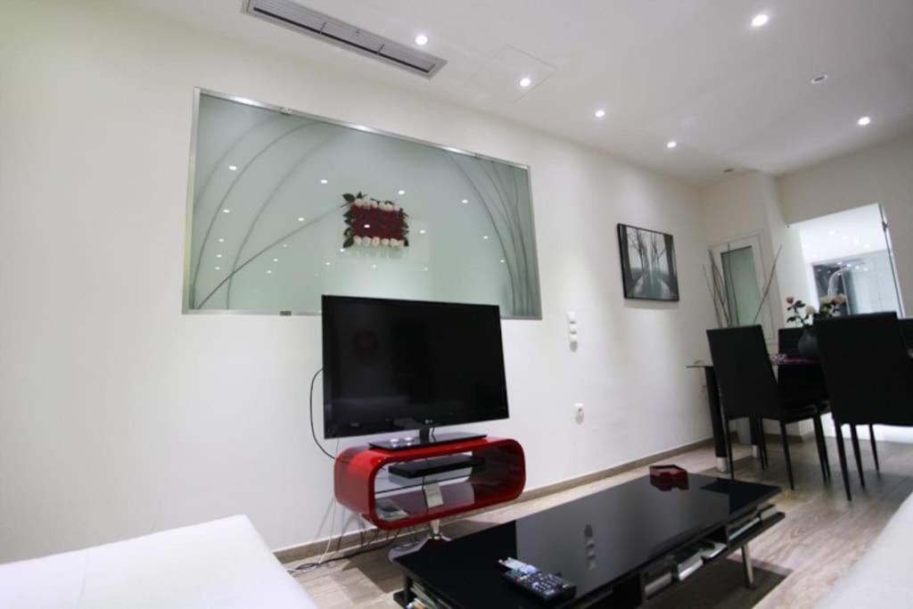 Televízia a/alebo spoločenská miestnosť v ubytovaní Olvias Apartment
