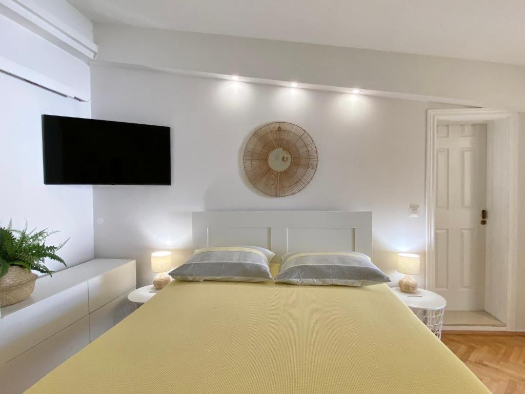 Postel nebo postele na pokoji v ubytování Apartmani Marko