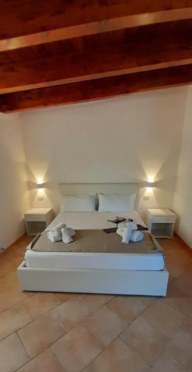 Postel nebo postele na pokoji v ubytování Borgo Degli Ulivi Rooms