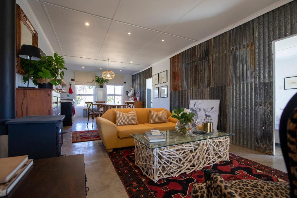 a living room with a couch and a table at Springvale Farm in Nottingham Road