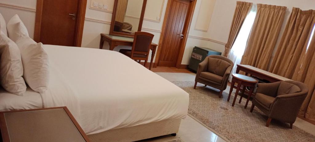 Postel nebo postele na pokoji v ubytování Salalah Premium Villas
