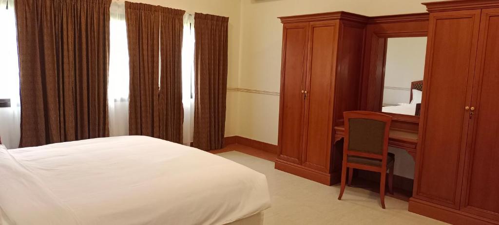 Postel nebo postele na pokoji v ubytování Salalah Premium Villas