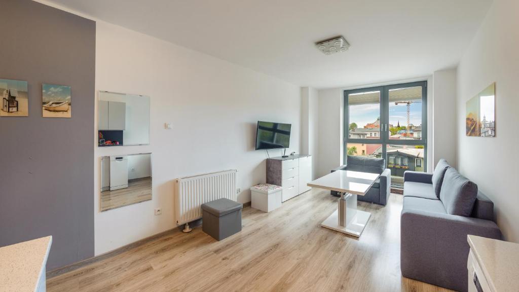 TV a/nebo společenská místnost v ubytování Apartamenty Sun & Snow Międzyzdrojski Rynek