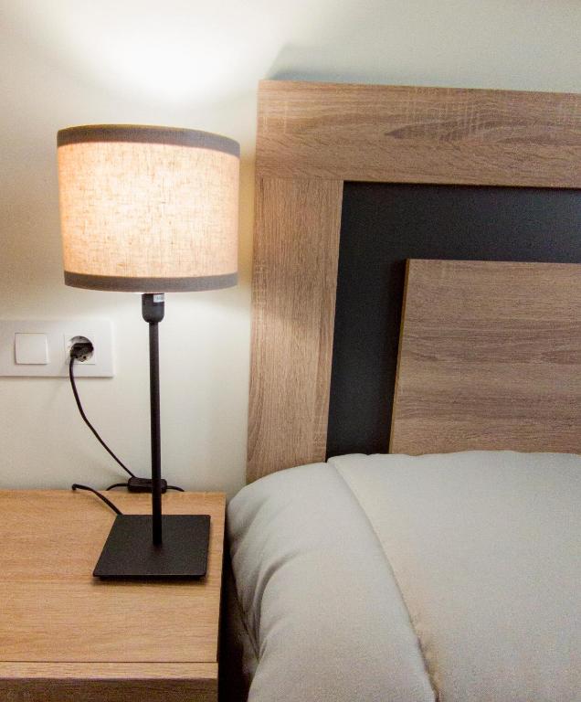 Posteľ alebo postele v izbe v ubytovaní Apartamentos Turísticos Hornillo AT-CC-00681