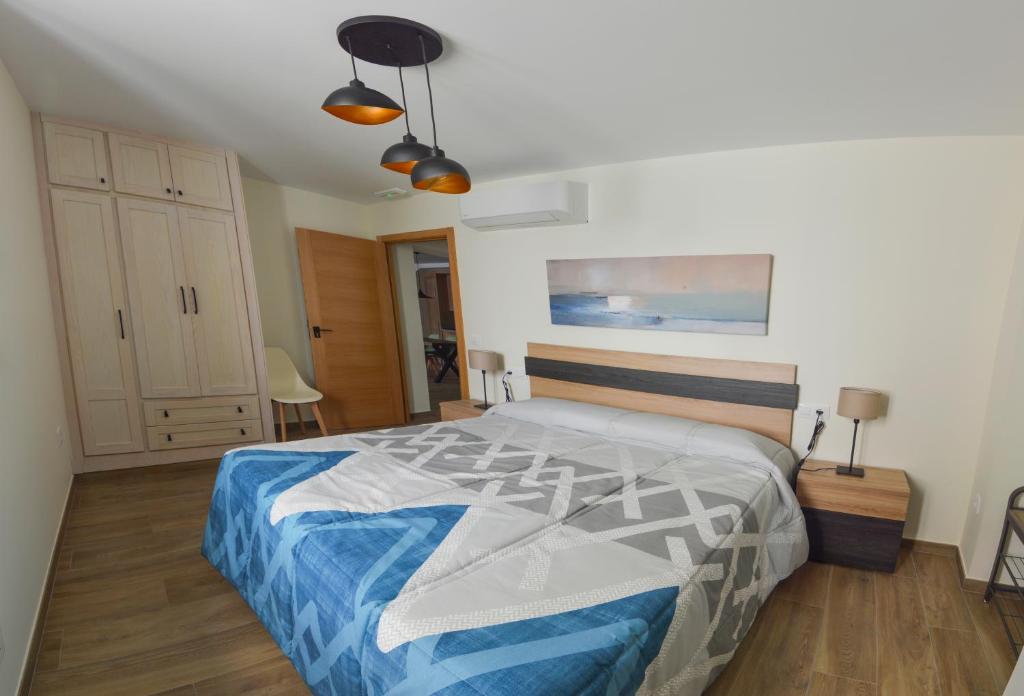Posteľ alebo postele v izbe v ubytovaní Apartamentos Turísticos Hornillo AT-CC-00681