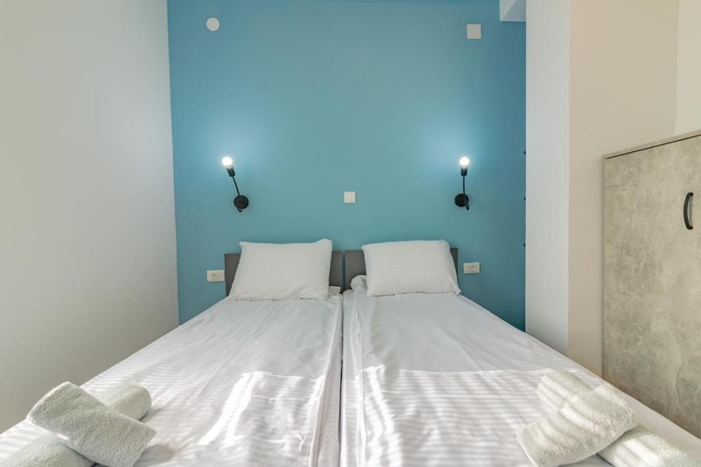 Postel nebo postele na pokoji v ubytování AGH Elite Apartments & Studios