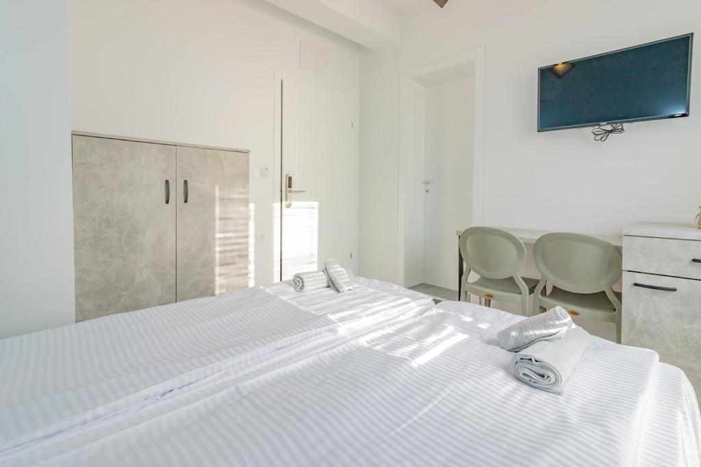 Postel nebo postele na pokoji v ubytování AGH Elite Apartments & Studios