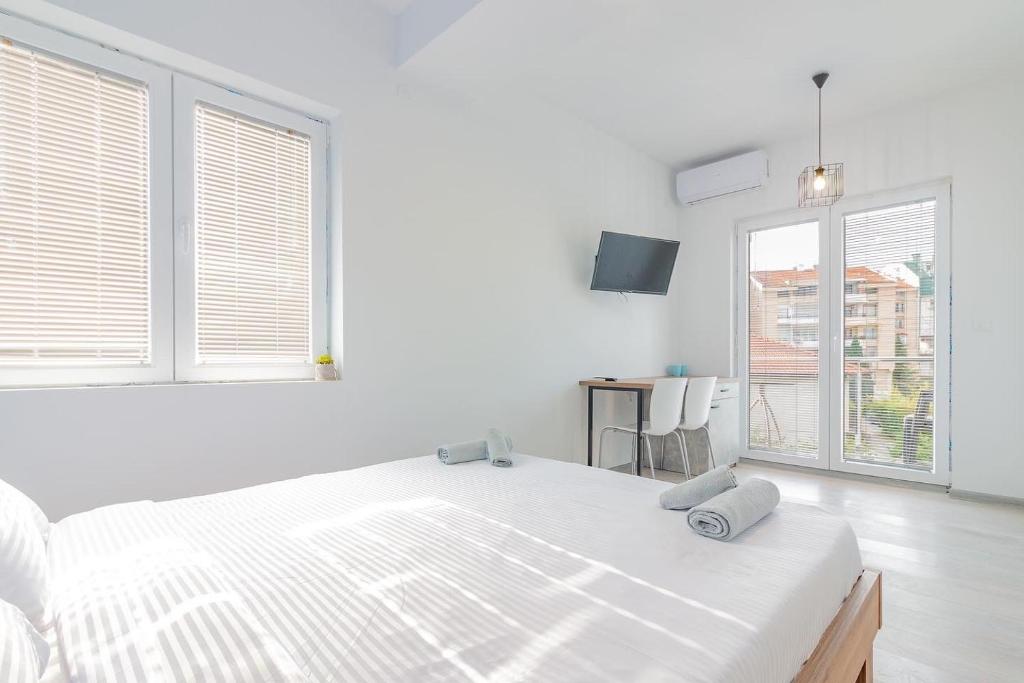 Postel nebo postele na pokoji v ubytování AGH Elite Apartments & Studios