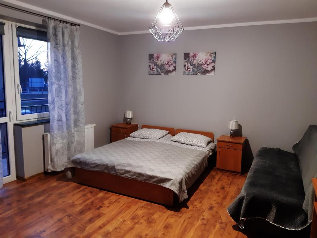 En eller flere senge i et værelse på DOM GOŚCINNY SZYPER