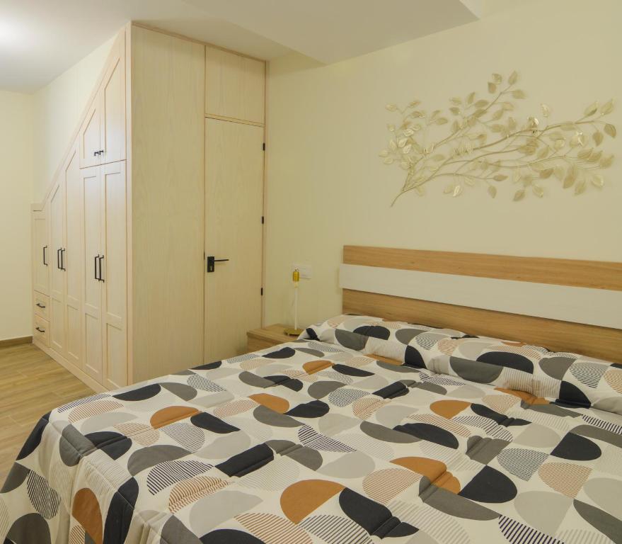 Posteľ alebo postele v izbe v ubytovaní Apartamentos Turísticos Hornillo AT-CC-00681