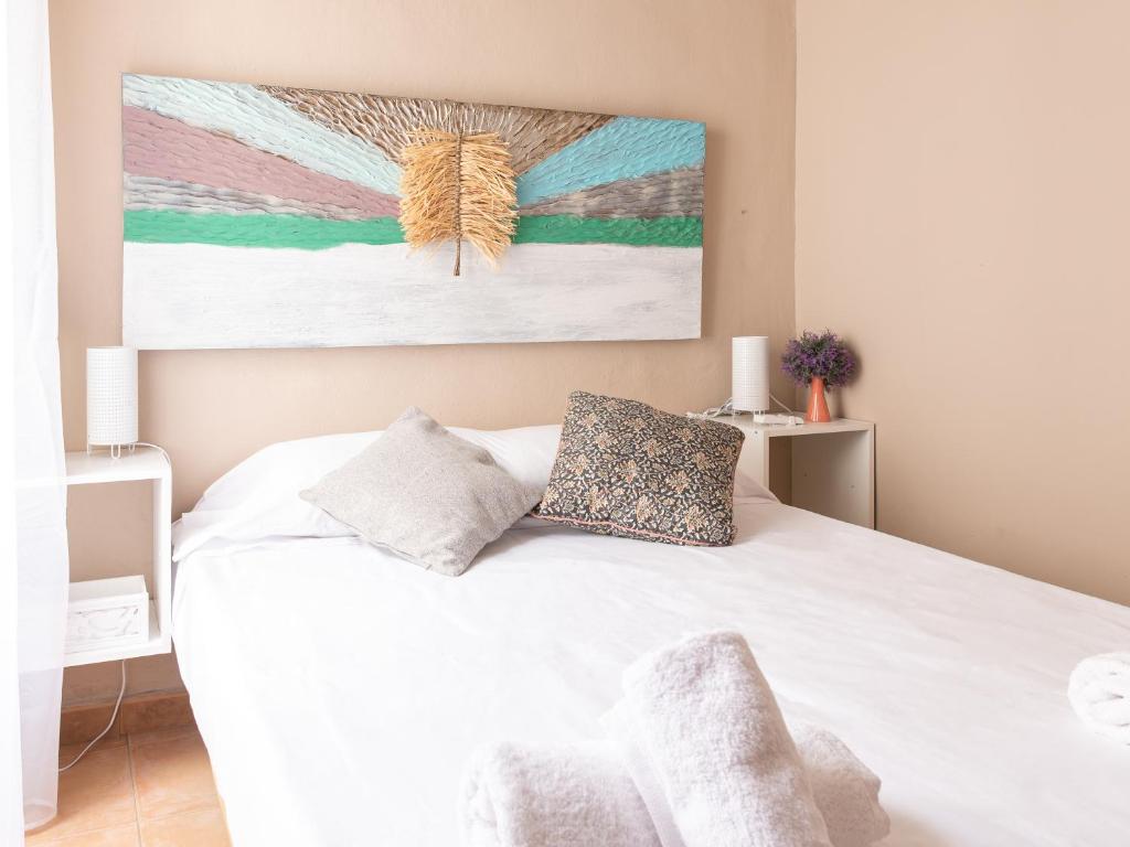 A bed or beds in a room at Apartamento Nayber Especieros