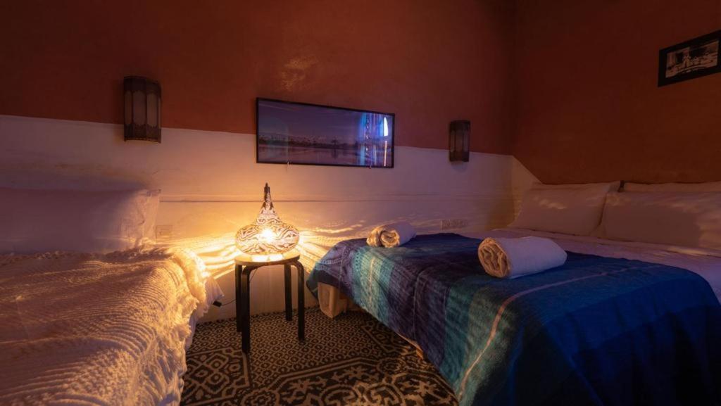 Кровать или кровати в номере Sahara bivouac