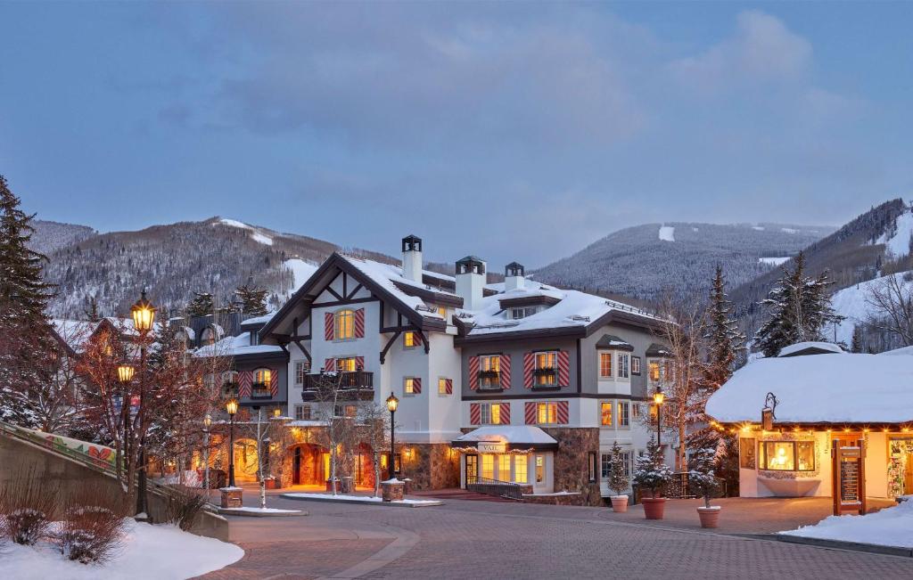 a large house in the mountains with snow at Austria Haus Hotel in Vail