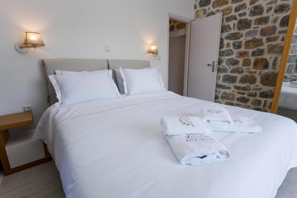Postel nebo postele na pokoji v ubytování POSEIDON-APEA Villas