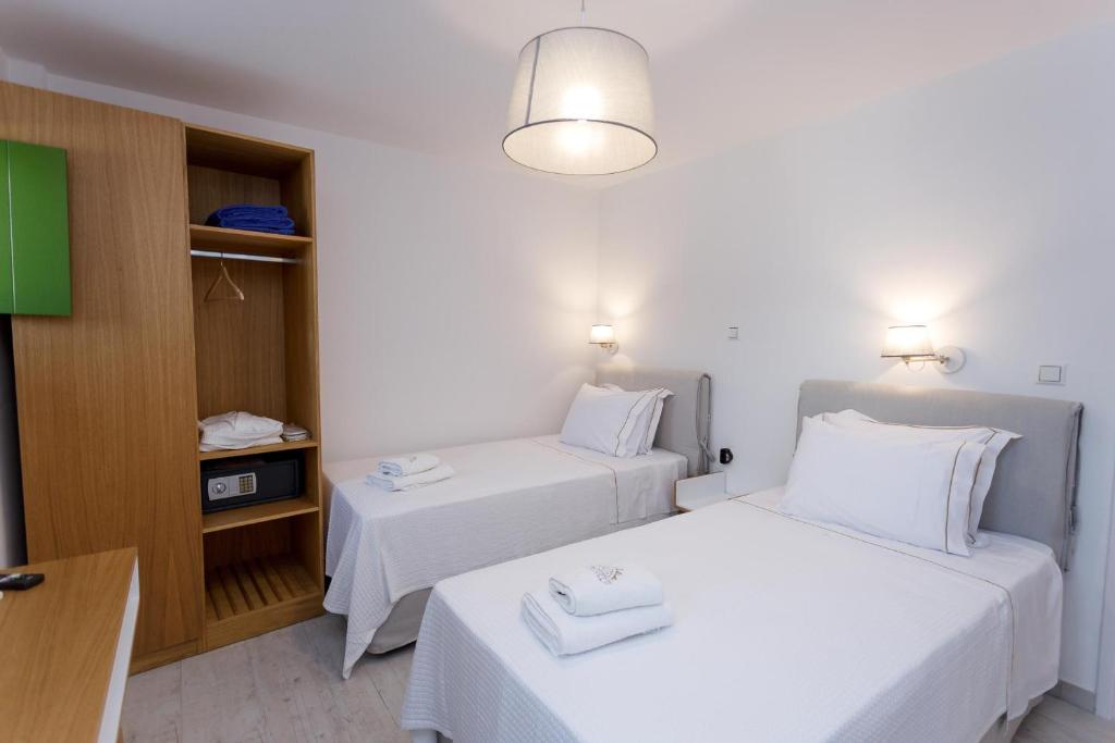 Postel nebo postele na pokoji v ubytování POSEIDON-APEA Villas