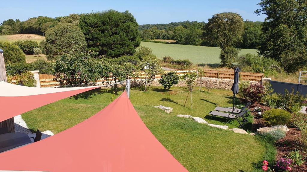 an overhead view of a red tent in a garden at AMARRÉ Chambres d'Hôtes in Sarzeau
