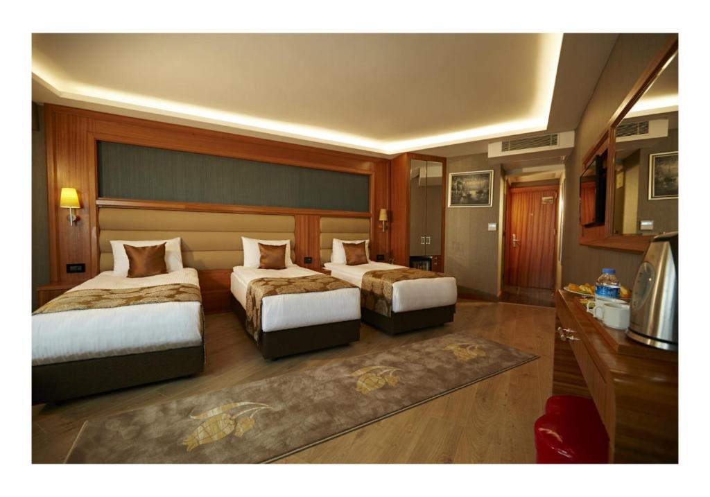 Postel nebo postele na pokoji v ubytování Ilkbal Deluxe Hotel &Spa Istanbul