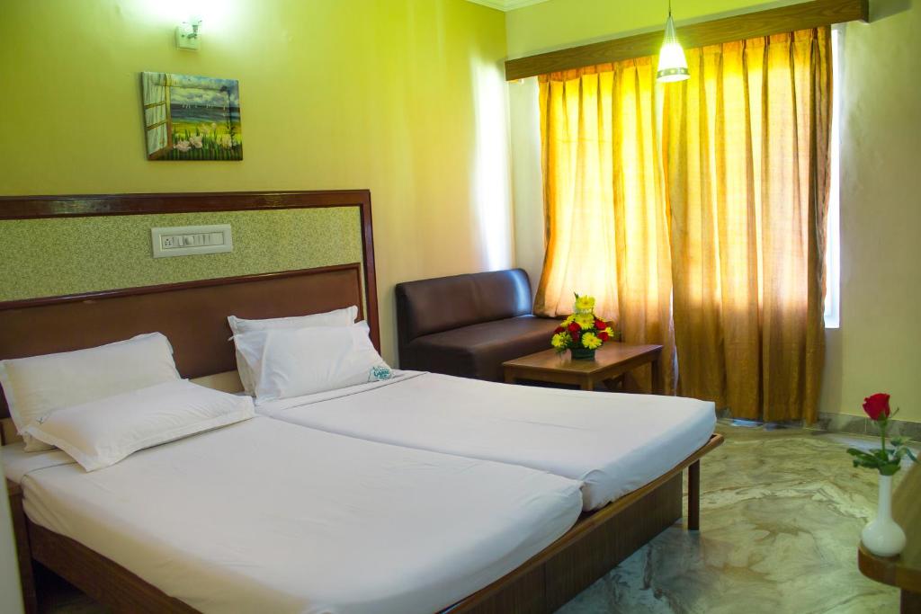 Postel nebo postele na pokoji v ubytování Hotel Chennai Gate