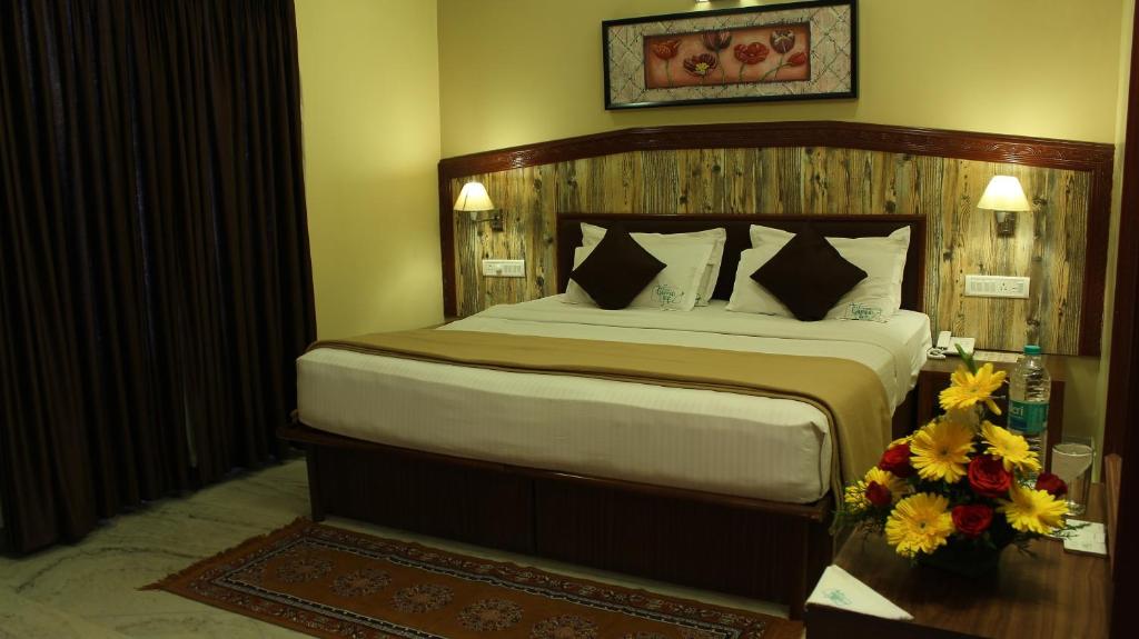 Postel nebo postele na pokoji v ubytování Hotel Chennai Gate