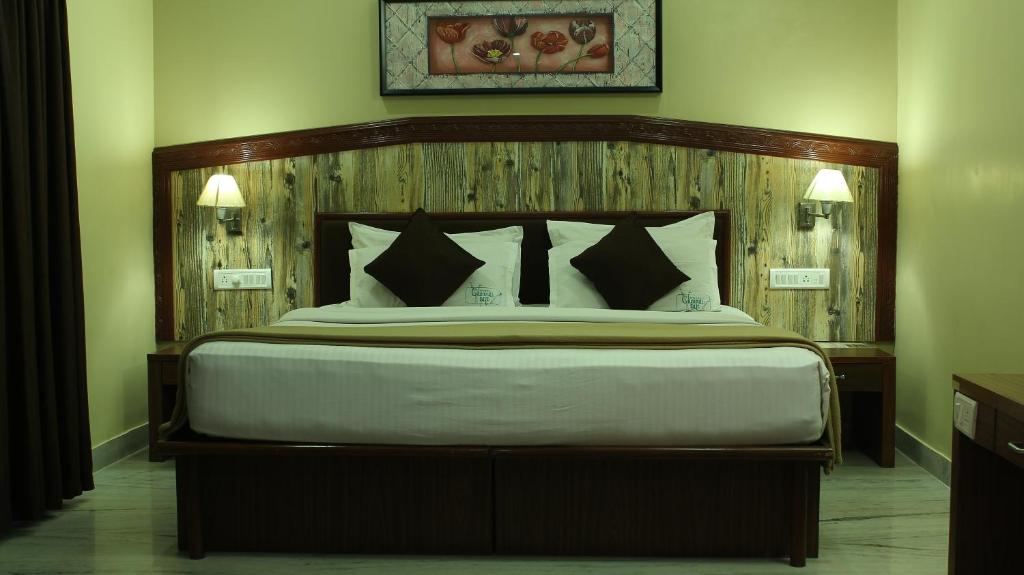 Postel nebo postele na pokoji v ubytování Hotel Chennai Gate