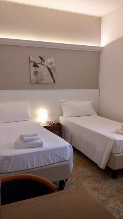 Posteľ alebo postele v izbe v ubytovaní Hotel Elefante
