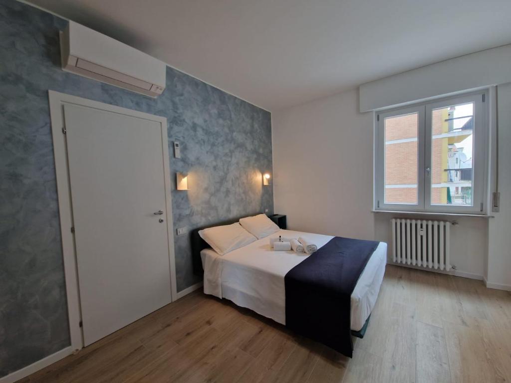 Ein Bett oder Betten in einem Zimmer der Unterkunft San Rocco Apartments - Royal Welcome