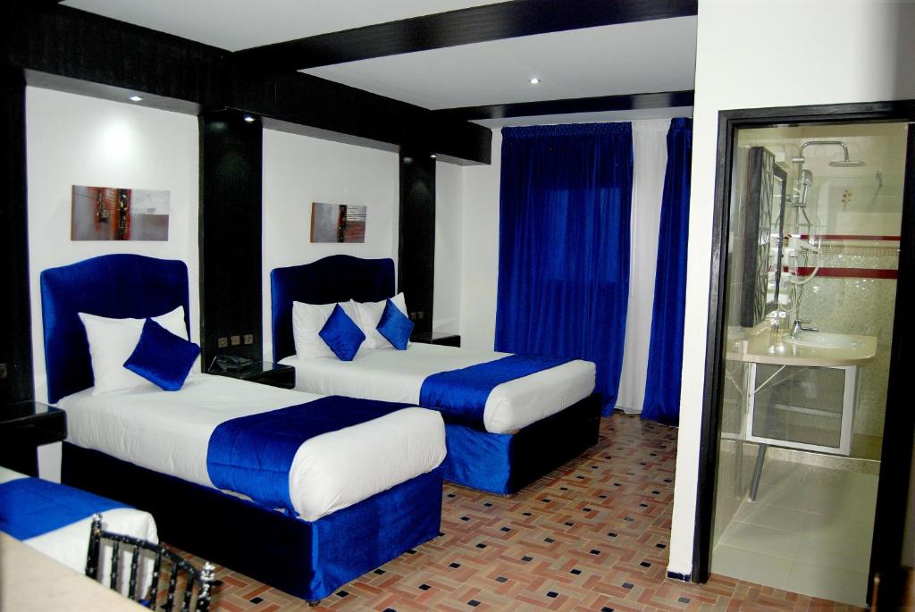 Postel nebo postele na pokoji v ubytování Hotel Al Khaima