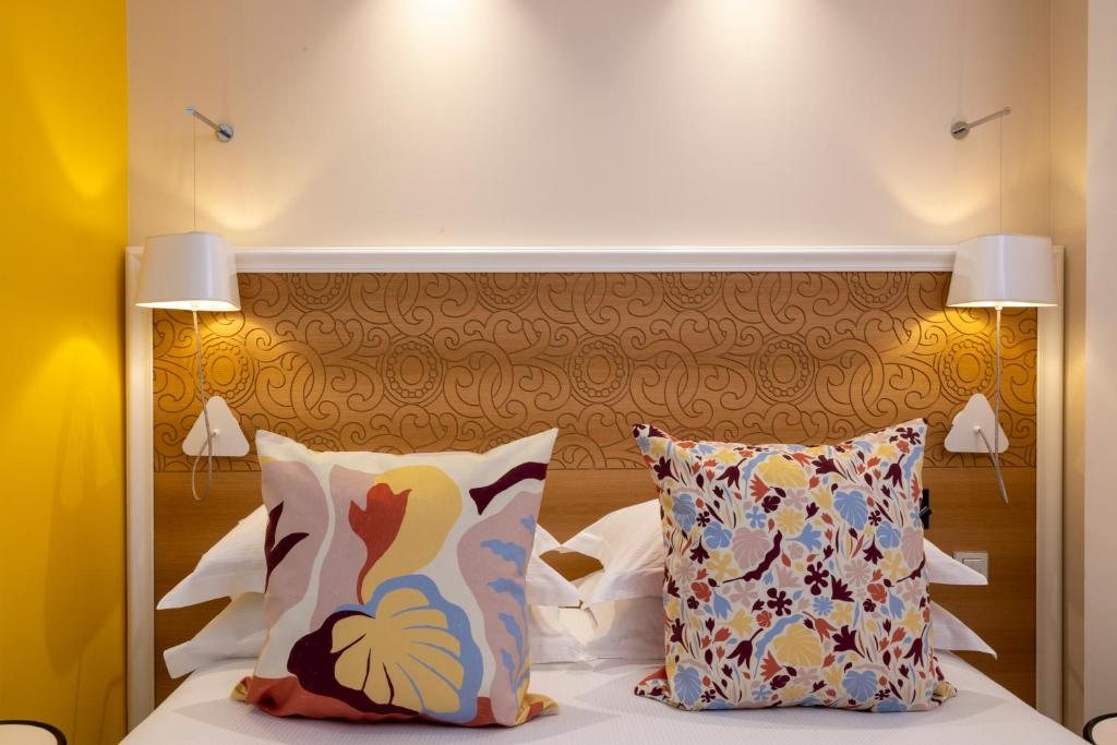 Postel nebo postele na pokoji v ubytování Hotel Elysees 8