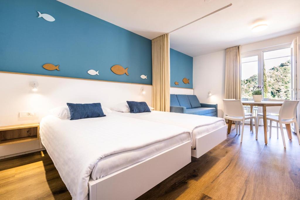 Postel nebo postele na pokoji v ubytování Bioenergy Resort Salinera Apartments