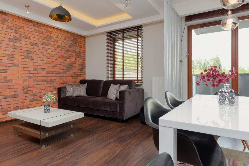 Posedenie v ubytovaní Apartment Warsaw Airport Kłobucka by Noclegi Renters