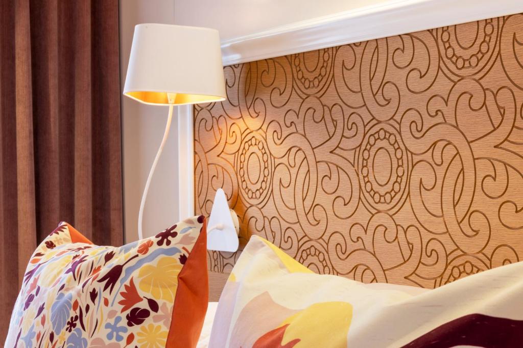 Postel nebo postele na pokoji v ubytování Hotel Elysees 8