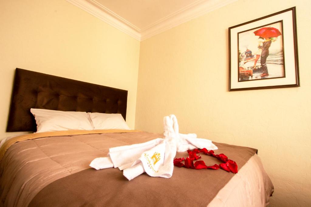 Postel nebo postele na pokoji v ubytování Hostal Virreinal AQP