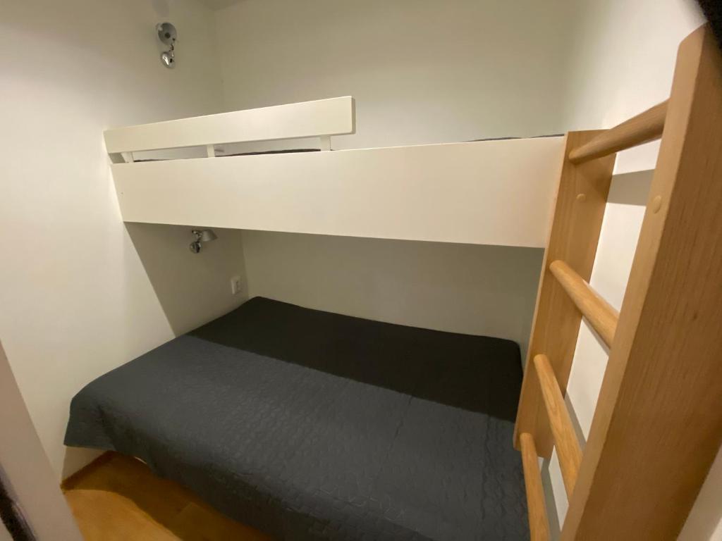 Кровать или кровати в номере Vuokatti Chalets Aarni