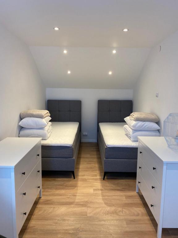 Posteľ alebo postele v izbe v ubytovaní Apartamenty 8 i 10 osobowe Koniakówka Resort