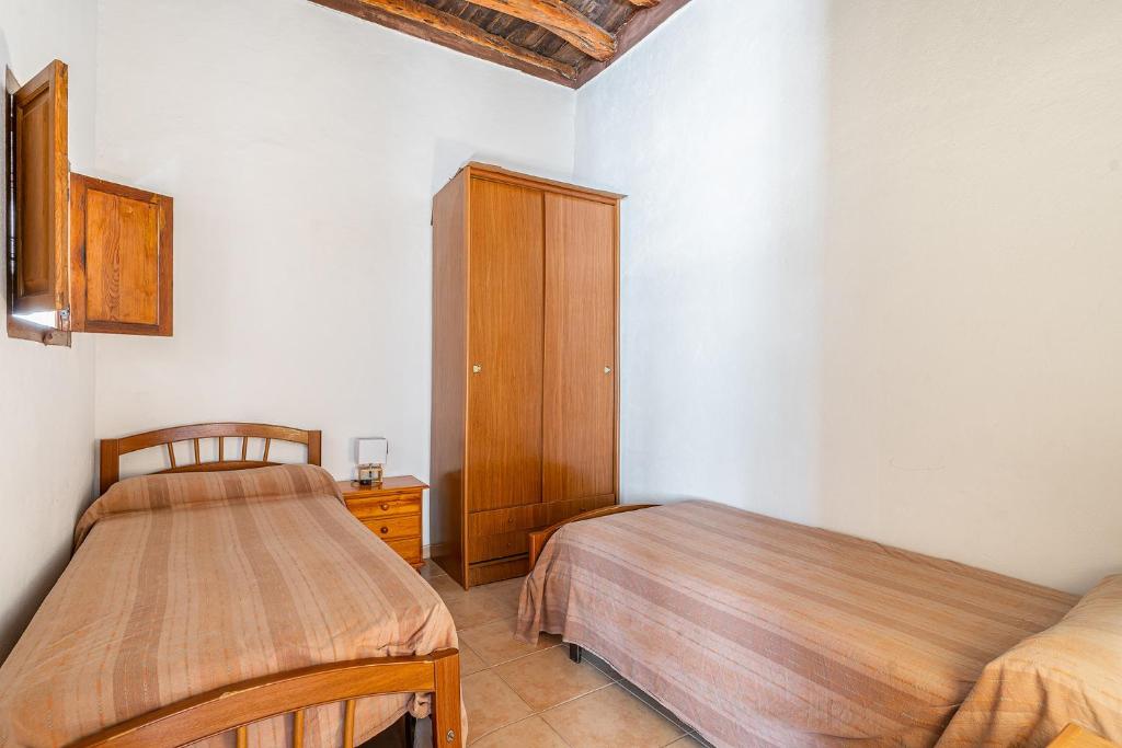 Postel nebo postele na pokoji v ubytování Cas Consul