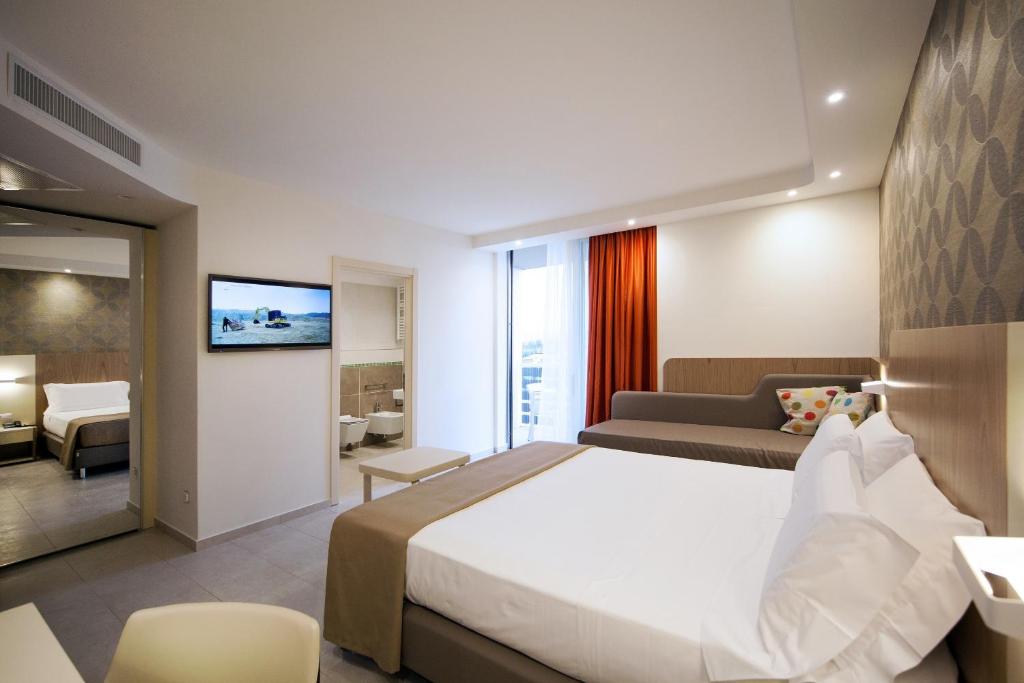 Postel nebo postele na pokoji v ubytování Hotel Aria