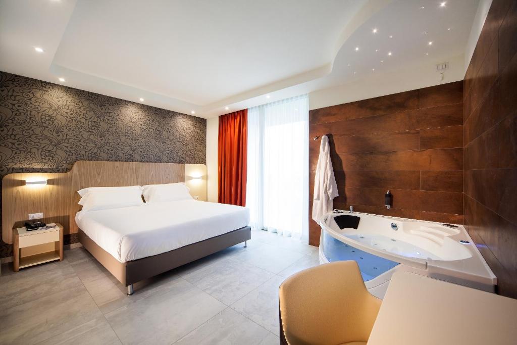 Postel nebo postele na pokoji v ubytování Hotel Aria