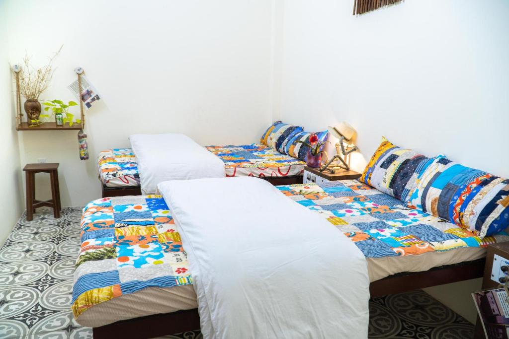 Giường trong phòng chung tại Hue Eco Homestay